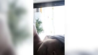 Large breasts on window