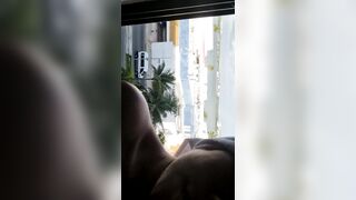 Large breasts on window