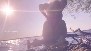 Bikini ass teasing in the water at a public beach!