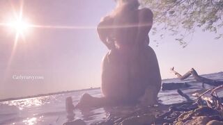 Bikini ass teasing in the water at a public beach!