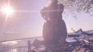 Bikini ass teasing in the water at a public beach!