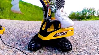 Large excavator is destroyed kicked, trampled, crushed, smashed, crushed, broken plastic car, crush