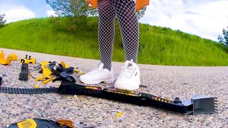 Large excavator is destroyed kicked, trampled, crushed, smashed, crushed, broken plastic car, crush