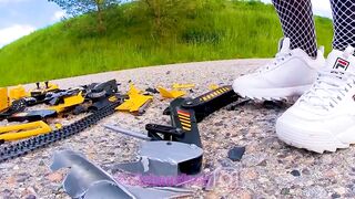 Large excavator is destroyed kicked, trampled, crushed, smashed, crushed, broken plastic car, crush
