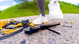 Large excavator is destroyed kicked, trampled, crushed, smashed, crushed, broken plastic car, crush