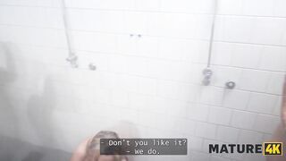 MATURE4K. Redhead aged floozy is having sex in prison shower whilst everybody is watching