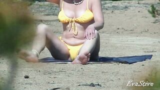 Mamma strips on the beach thinking that no one sees her