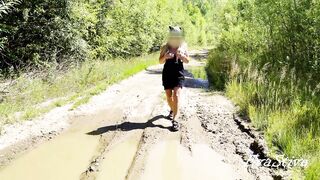 hot golden-haired pissing in a puddle on the road
