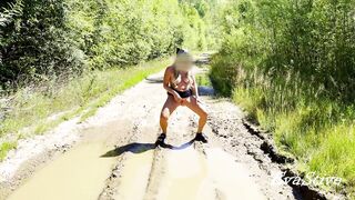 hot golden-haired pissing in a puddle on the road