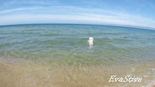 In nature's garb mama bathing bare in the sea