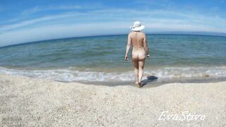 In nature's garb mama bathing bare in the sea