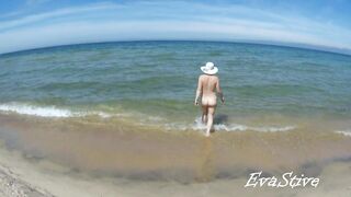 In nature's garb mama bathing bare in the sea