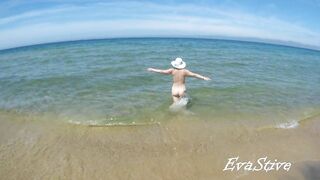 In nature's garb mama bathing bare in the sea