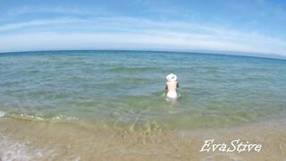 In nature's garb mama bathing bare in the sea