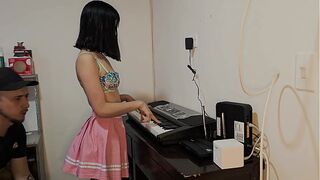 Marvelous youthful woman in pink petticoat screwed up wanting to play piano