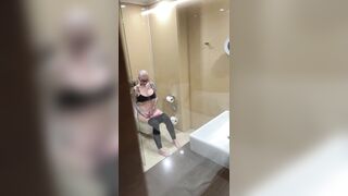 Breasty angel watches porn and jerks off on the crapper, peeping
