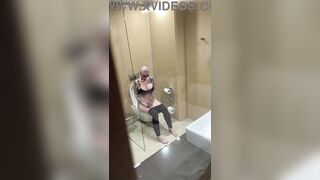 Breasty angel watches porn and jerks off on the crapper, peeping