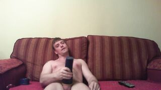 Watching porn playing with a blue fleshlight