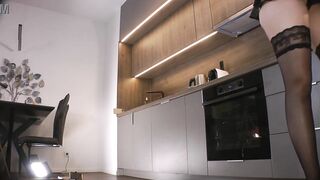 Sexy and lustful lengthy legs blond in ebony nylons shows her butt below leather petticoat to tease and get attention