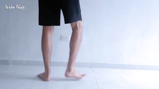 Lengthy legs and hot feet doing squats during the time that stripping