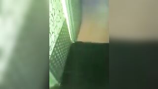 2 lesbians in a bar bathroom.
