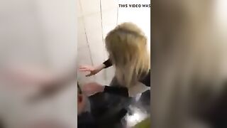 2 lesbians in a bar bathroom.