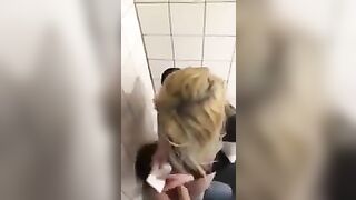 2 lesbians in a bar bathroom.