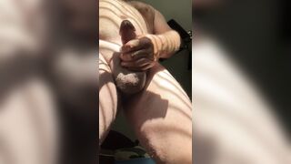 Stocky Dad Bear jerking his rod in the sunlight