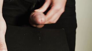 Thick uncut jock growing in ebony jeans. Natural foreskin. Cum on ebony plate.