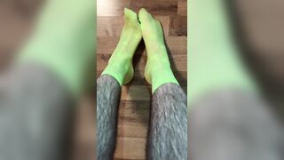 Enjoying in fresh neon dotted green socks