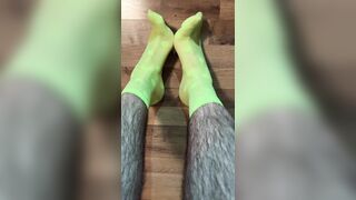 Enjoying in fresh neon dotted green socks