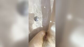 Stomach button fetish in the bathroom, lengthy legs and constricted charming cunt underneath water close up