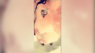 big beautiful woman large bazookas lathered up with soap in the shower