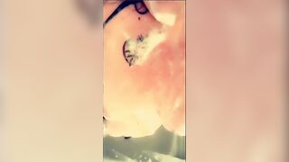 big beautiful woman large bazookas lathered up with soap in the shower