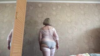Trying on fresh white pants. A aged big beautiful woman shakes her large booty. PAWG.