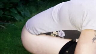 pissing and screwing a bottle in the park