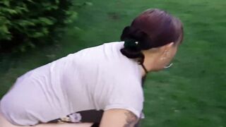 pissing and screwing a bottle in the park