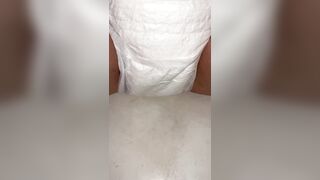 Chick fills up diaper with urinate until it overflows out the side