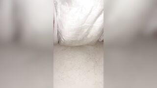 Chick fills up diaper with urinate until it overflows out the side