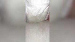 Chick fills up diaper with urinate until it overflows out the side