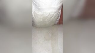 Chick fills up diaper with urinate until it overflows out the side