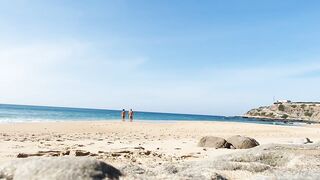 Fitness pair disrobe on a public beach and masturbate with people watching