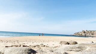 Fitness pair disrobe on a public beach and masturbate with people watching