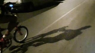 Hot chap disrobes on a public street and rides a bike nude touching his weenie - risky