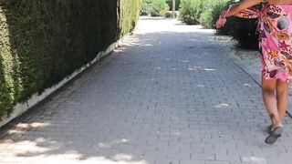 Sexy gal walking strips on a public street and shows off her cunt