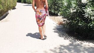 Sexy gal walking strips on a public street and shows off her cunt