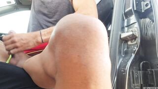 Hot exhibitionist jerks off in car in a risky way with people passing by