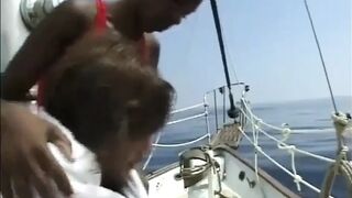 Pretty ebony body on the large white penis...ebony and white on the yacht