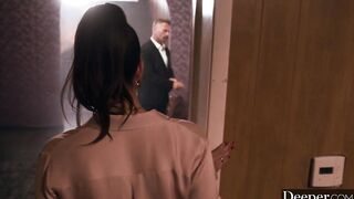 A cigar shop employee is at the service of an exacting customer.