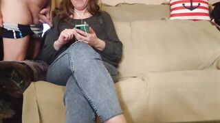 The mother i'd like to fuck looks at the phone during the time that giving him a tugjob
